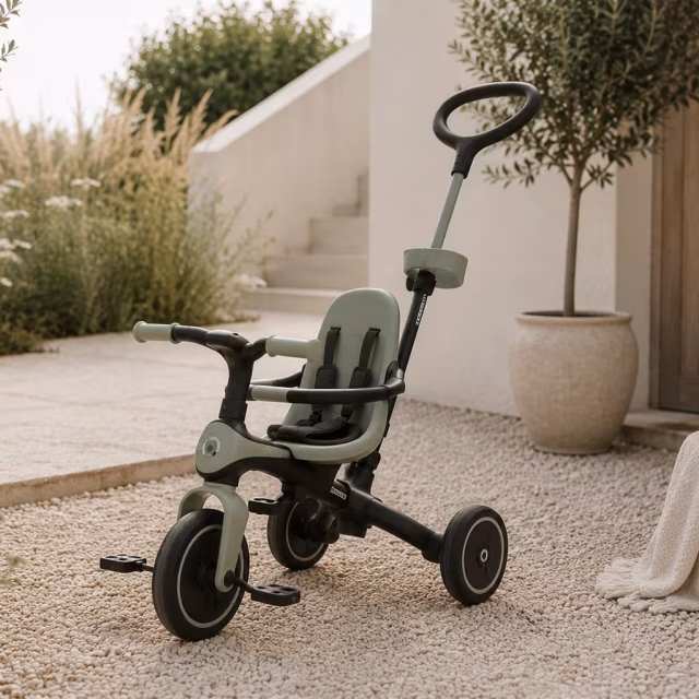 Green trike on a gravel garden path