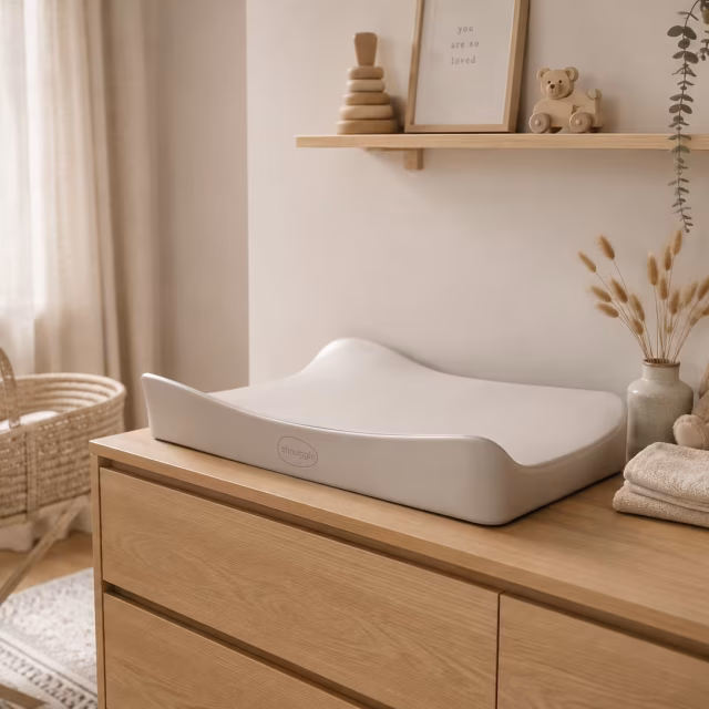 Changing mat on a wooden dresser in a nursery